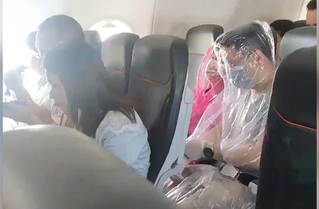 Passengers Wrap Themselves In Plastic On Flight