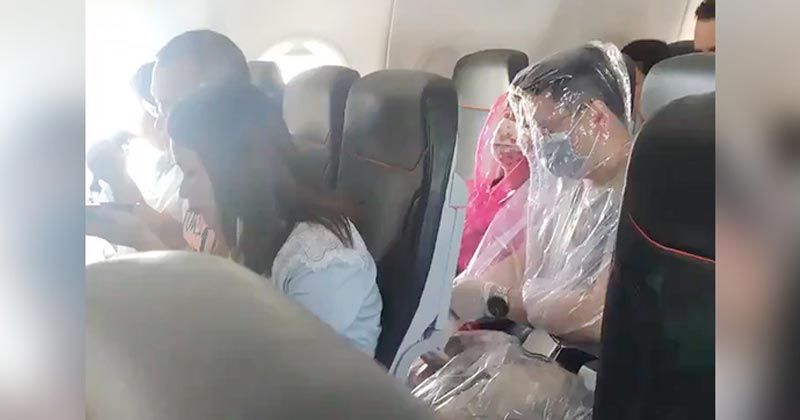 Passengers Wrap Themselves In Plastic On Flight