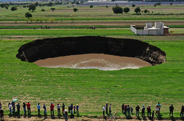 Massive Sinkhole Threatens House In Central Mexico